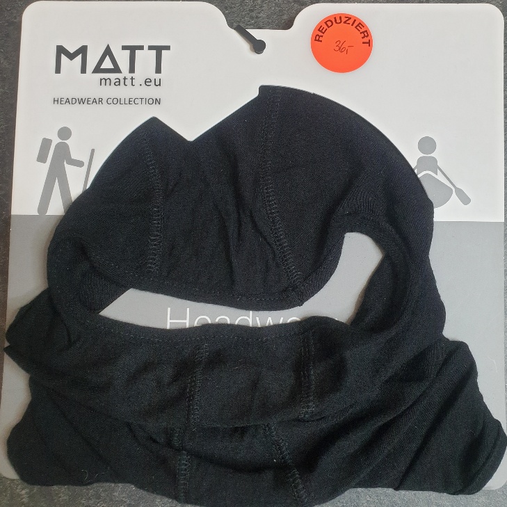 Schwarze Sturmhaube auf Kartonträger